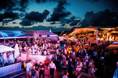 People dancing at Bernie'sPeople dancing at Bernie's Beach Club during the Dutch GP after party Beach Club