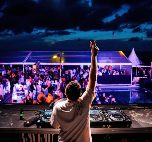 A DJ performs at Bernie's beach club during the Dutch GP after party