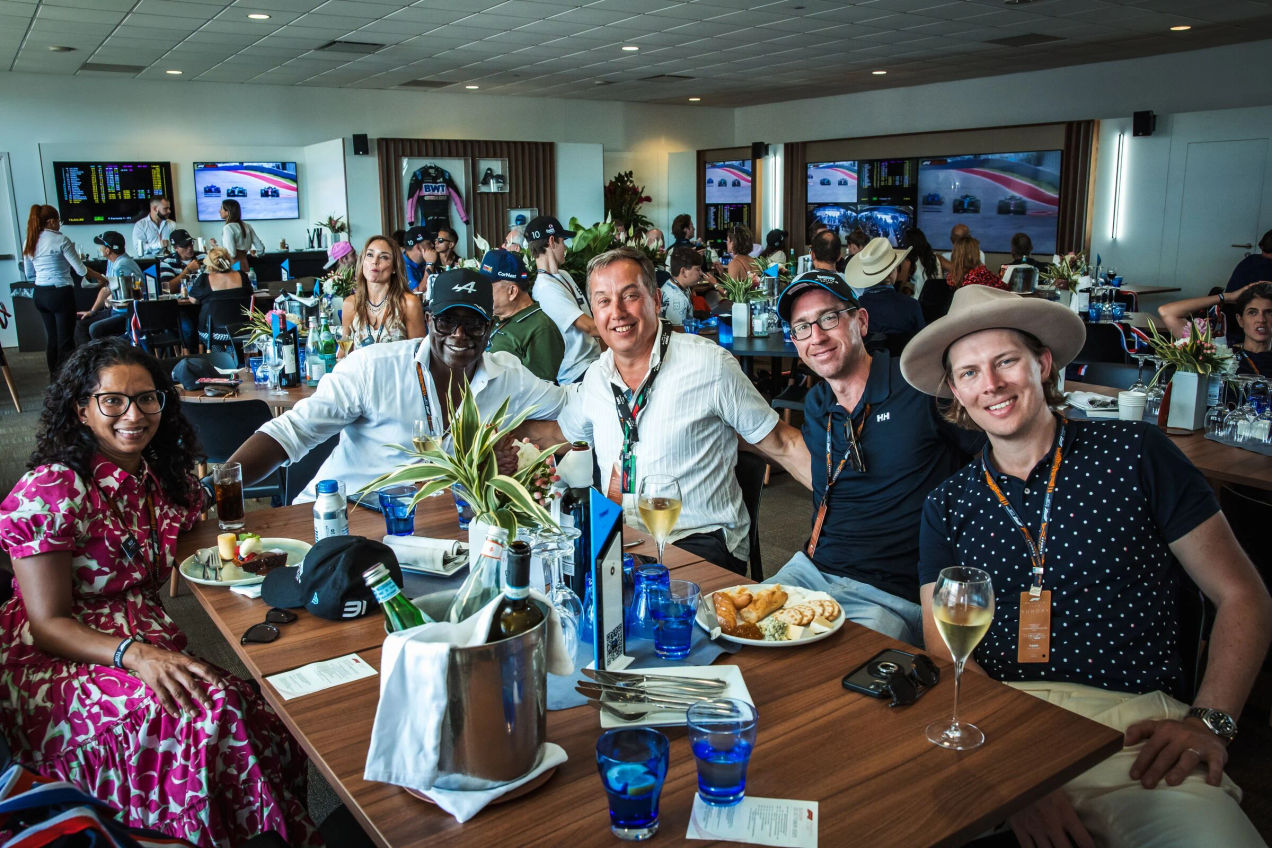 F1 fans enjoy the food and drinks in the Alpine Paddock Lounge