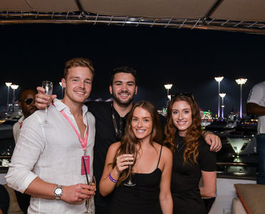 A group of visitors of the Yacht VIP Hospitality posing for a photo