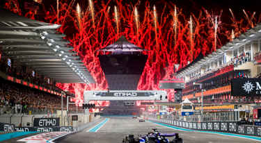 Fireworks going off as the F1 cars come down the Main Straight for the last time