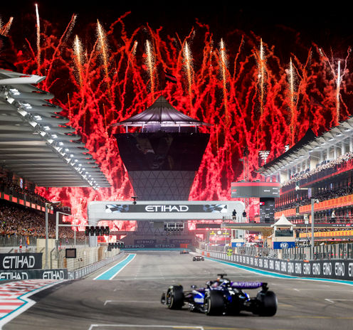 Fireworks going off as the F1 cars come down the Main Straight for the last time