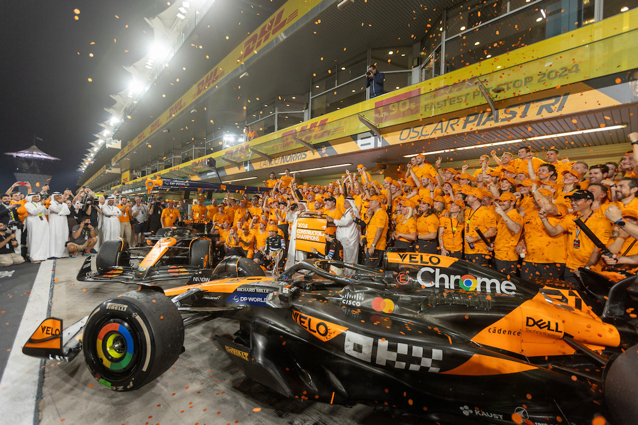 The McLaren team celebrates their constructors championship at the Abu Dhabi GP