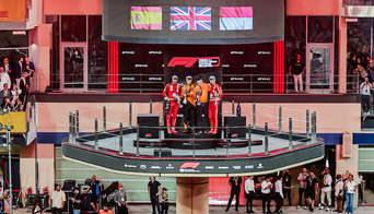 The podium ceremony at the Abu Dhabi GP with McLaren as the winner