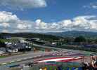 Grandstands Red Bull A & B gives you a view of the first turn of the circuit