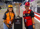 Fans pose with the F1 Trophy during the F1 Experiences-weekend