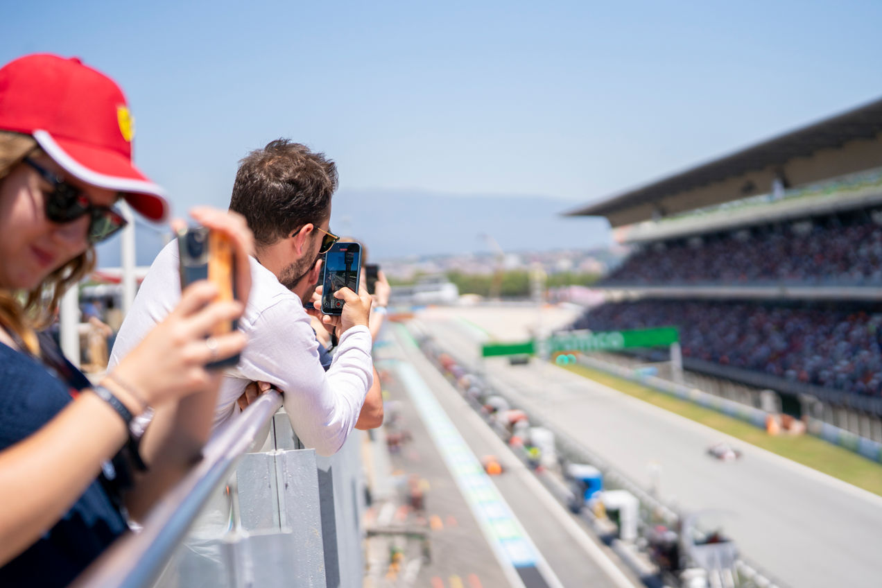Fans on the outside terrace of the Pit Lane Lounge