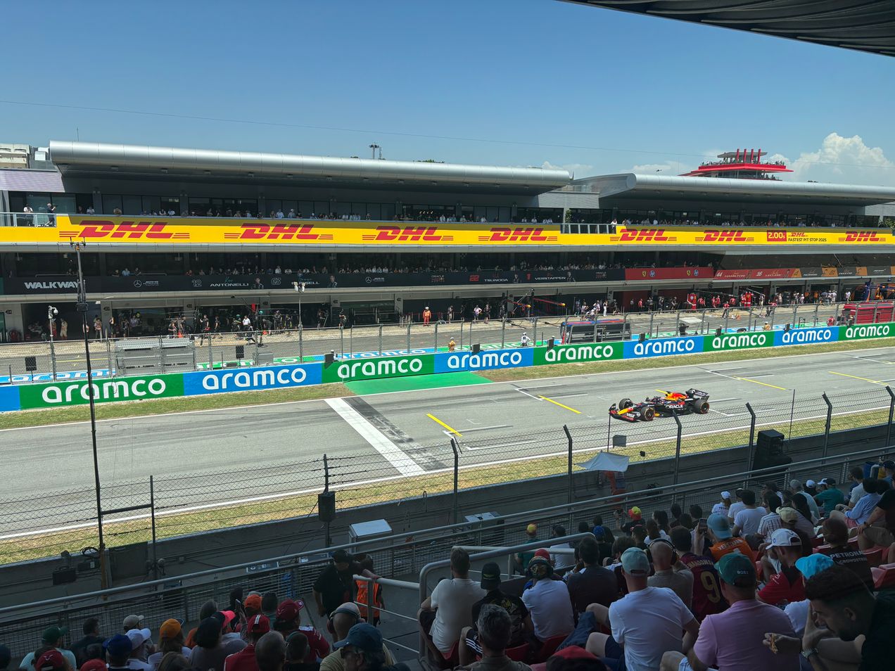 Max Verstappen driving down the main straight at the Barcelona GP