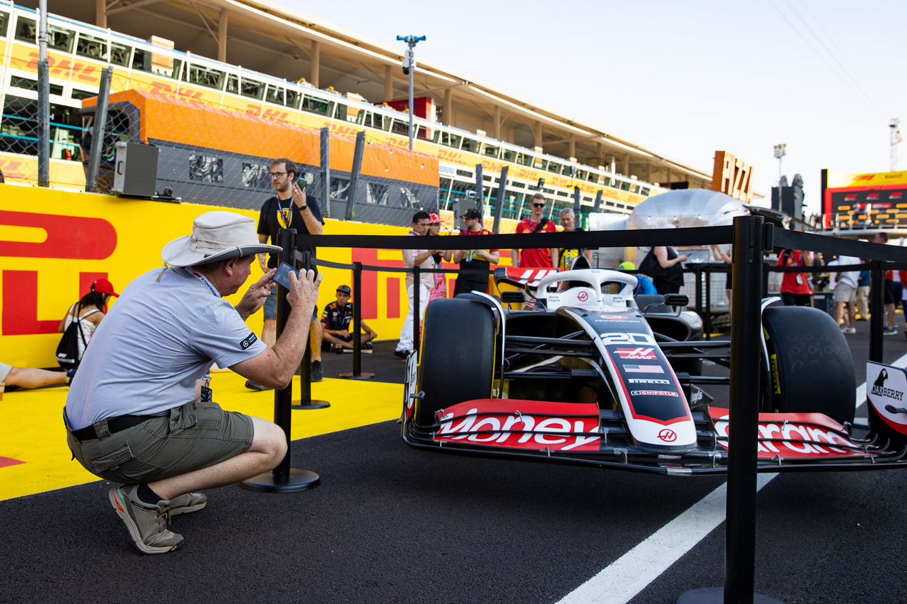 A Haas F1 car on display in the pit lane