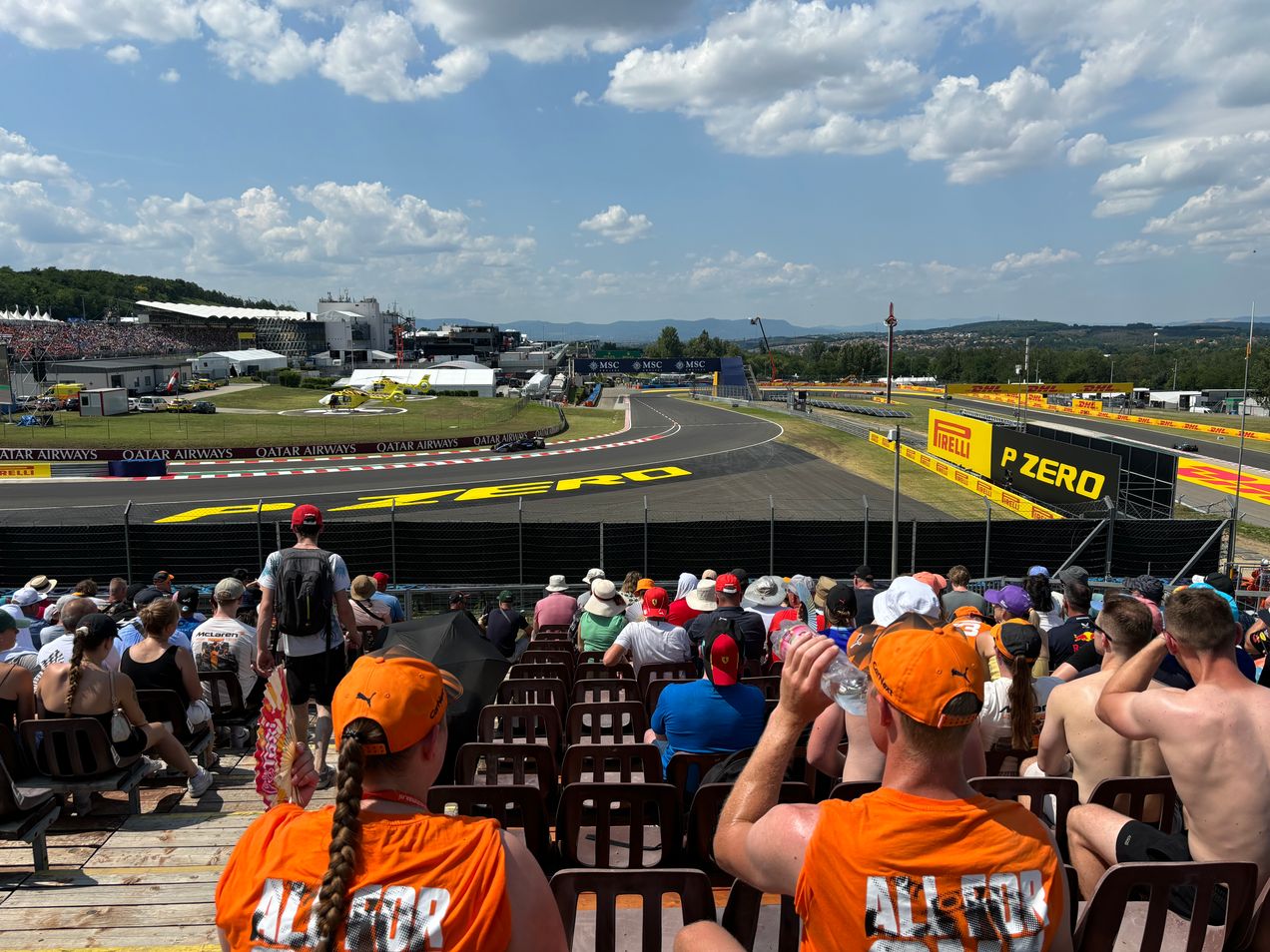 Fans on the Red Bull Grandstand on Hungaroring watching the F1 cars drive by