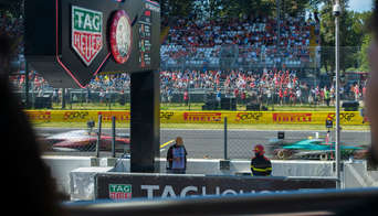 Watch the F1 cars drive by up close from the Race Club hospitality area