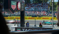 Watch the F1 cars drive by up close from the Race Club hospitality area