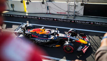 Max Verstappen in his Red Bull F1 car, photographed from the balcony of the Race Club