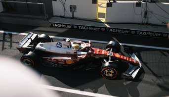 Lewis Hamilton in his Ferrari F1 car, photographed from the balcony of the Race Club