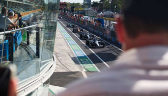 F1 cars lining up in the pit lane on Monza Circuit