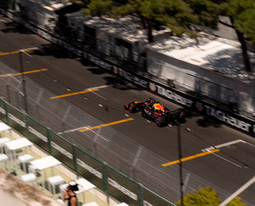 A Red Bull car driving past the Start/Finish VIP Terrace during the Monaco GP