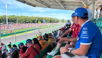 Fans on Grandstand 22 of Monza watching an F1 car drive by