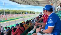 Fans on Grandstand 22 of Monza watching an F1 car drive by