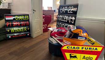 Old Ferrari items are displayed throughout the SGP Club