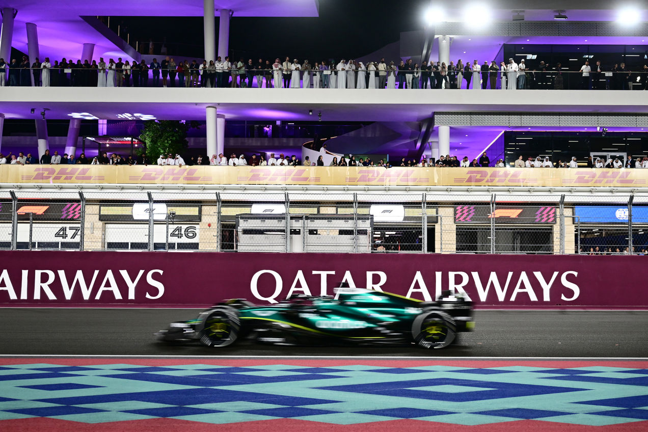 F1 car racing past the paddocks during the Qatar GP