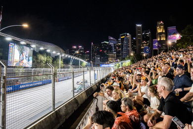 The Connaught grandstand packed with F1 fans with the Singapore skyline in the background