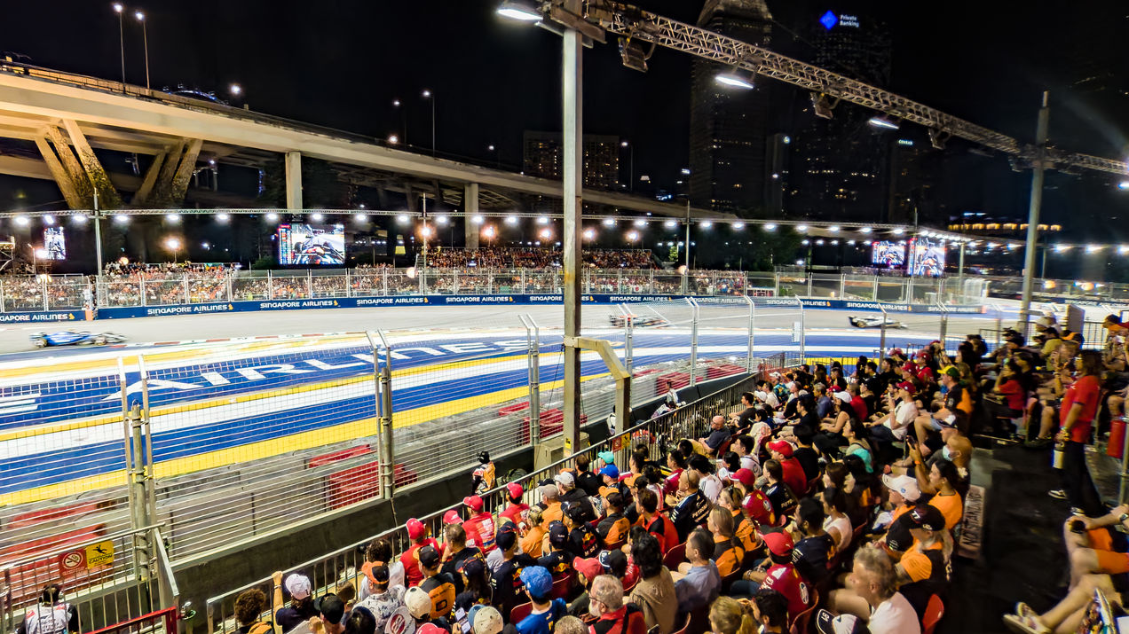 The Turn 2 Grandstand at the Singapore GP with fans following the race