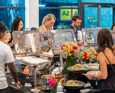 Guests eating food in the Lounge @ Turn 3