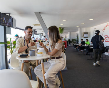 Guests enjoying the complimentary drinks in the Sky View Racing Lounge at the Spanish GP