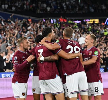 West Ham United players standing arm in arm before a match