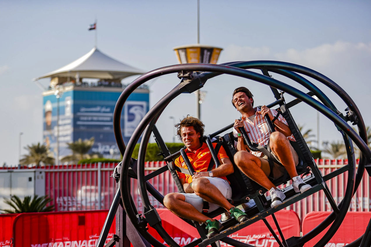 Two men on a rollercoaster ride on Yas Island at the Abu Dhabi Grand Prix