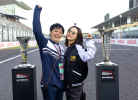 Fans pose with the Championship trophies at the Japanese GP
