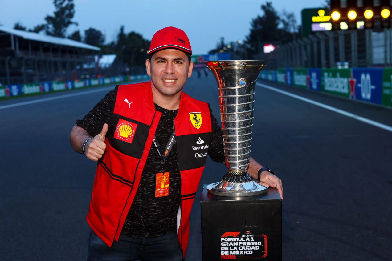 A Ferrari fan takes a photo with the Championship Trophy, part of the F1 Experiences weekend