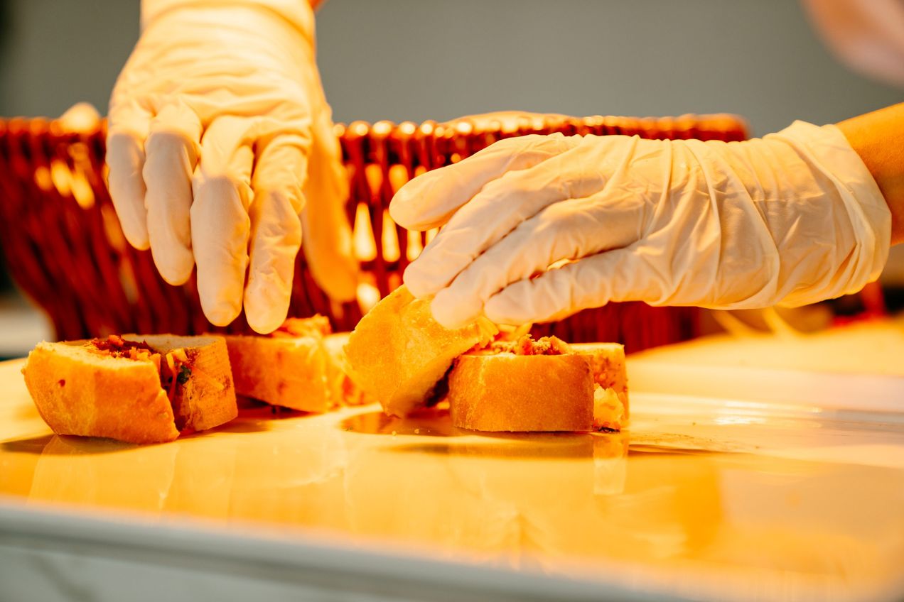 A chef plating up some food in the Singapore Champions Club