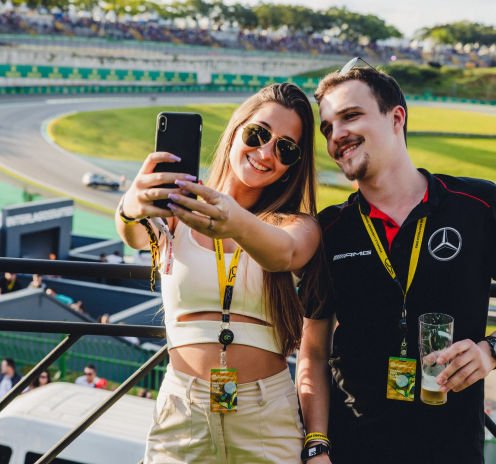 Grand Prix Club guests take a selfie with Interlagos on the background