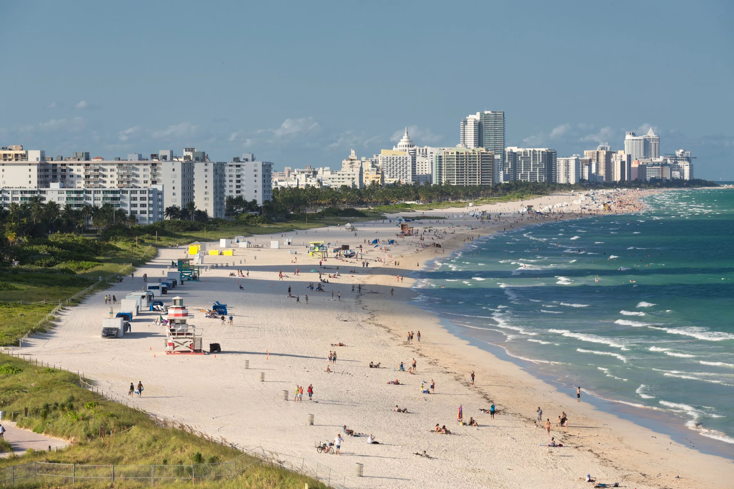 Late afternoon at the beach. People enjoying sunset and beautiful Miami South Beach