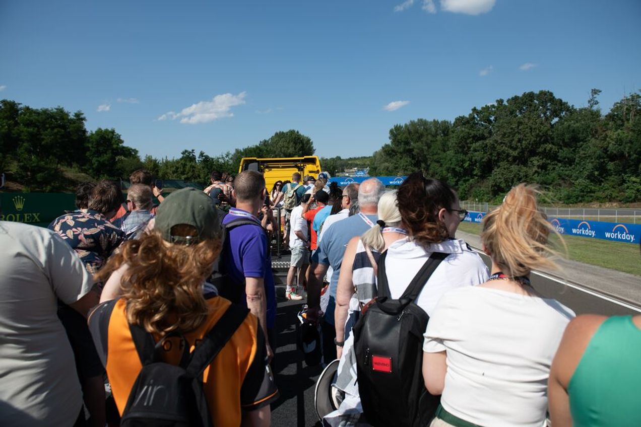F1 guests are taken on a guided tour of the circuit on a flat bed truck