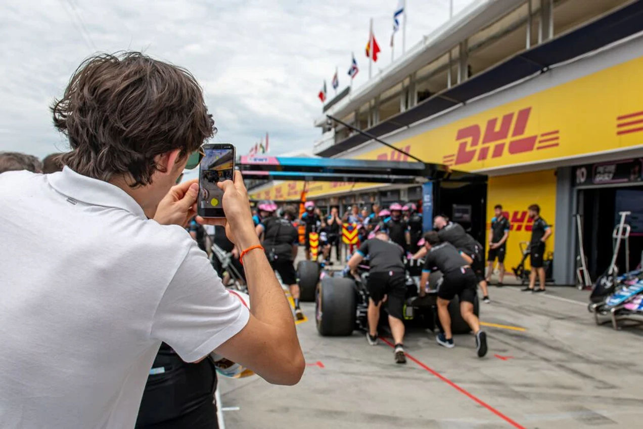 F1 fans take a walk through the pit lane
