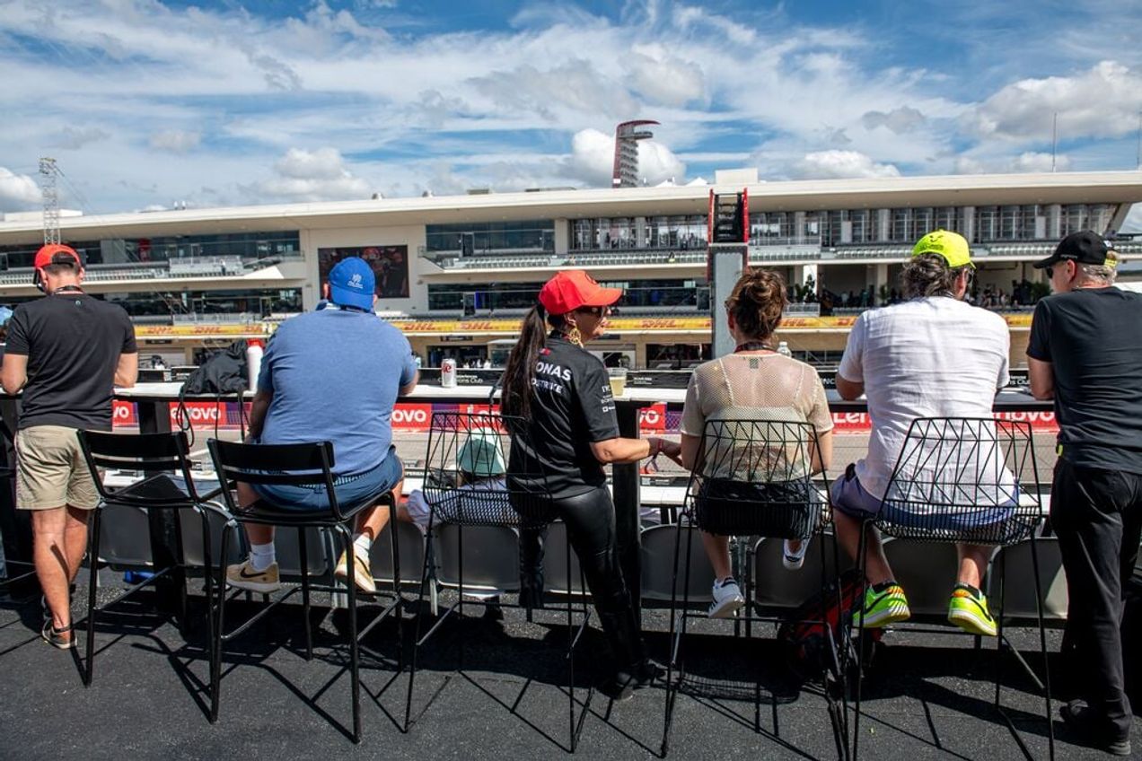 Guests of the Champions Club enjoy the view of the track from the terrace
