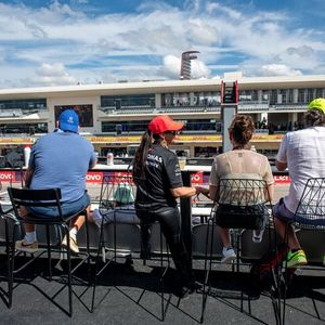 Guests of the Champions Club enjoy the view of the track from the terrace