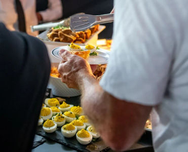 Guests enjoy the freshly prepared food in the Champions Club lounge