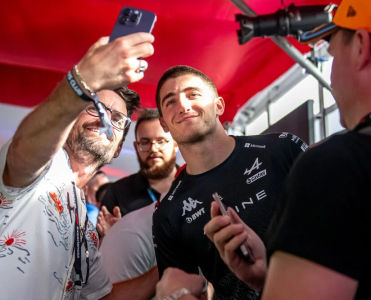 A special F1 guest interacts with fans in the Champion Club lounge