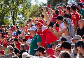 Formula 1 fans cheering in the stands at the Monza Grand Prix