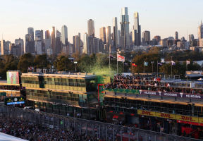 F1 fans walk on the track at the Australian GP